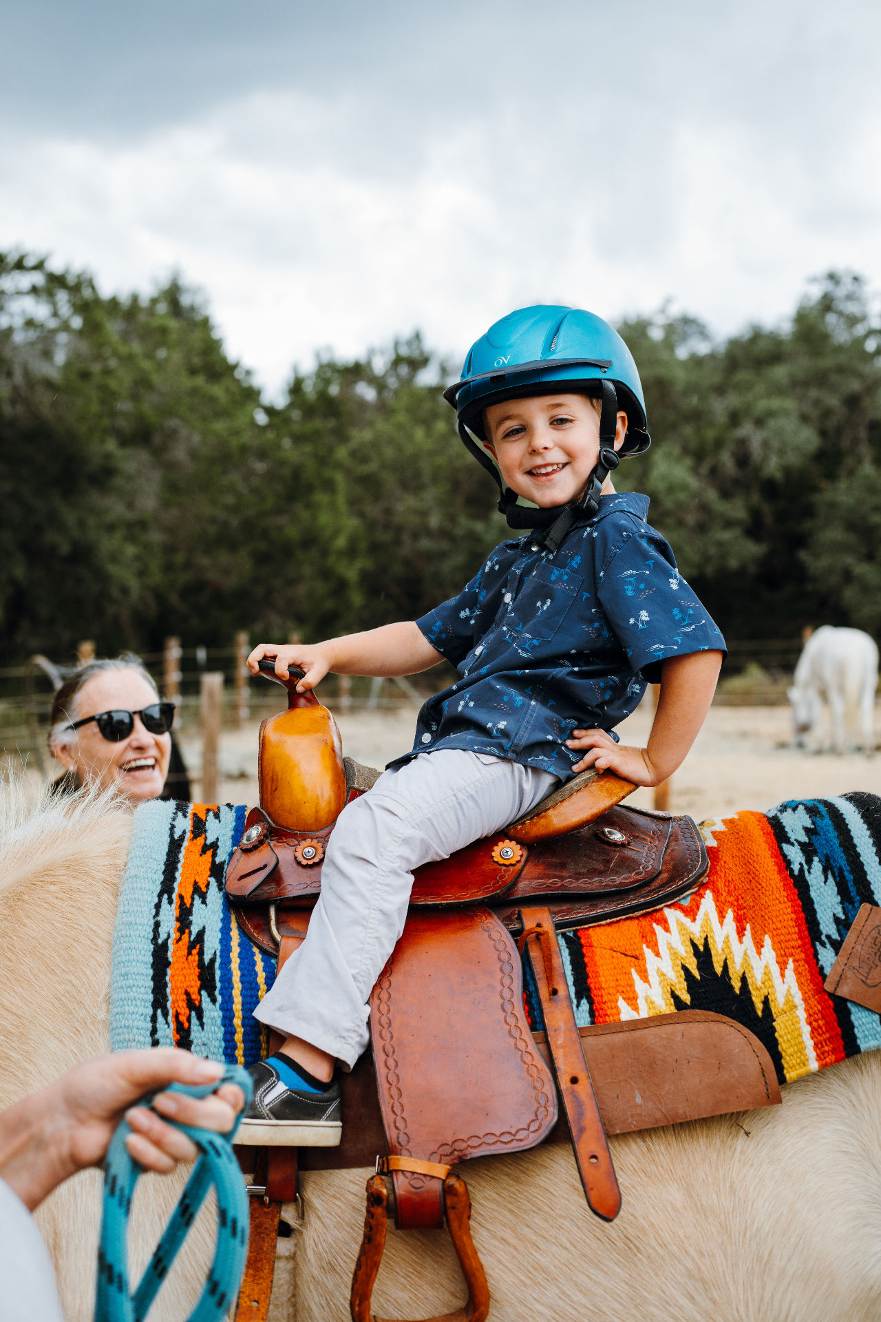 Young rider smiling in the saddle